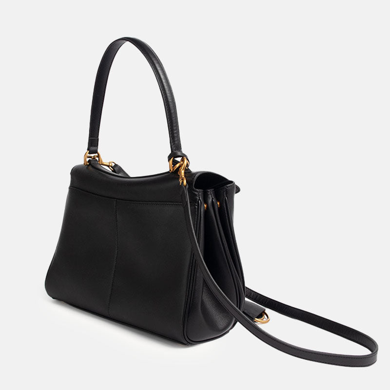Elegante schwarze Handtasche mit goldfarbener Schließe